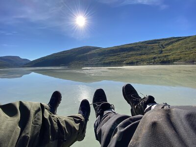 A relaxing moment with our feet over the lake