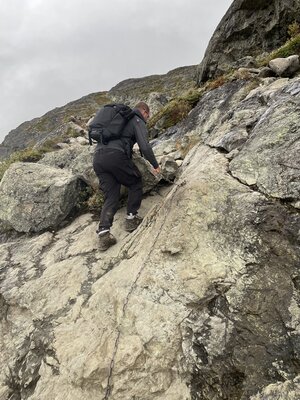 Pim uses chains to scale a steep incline