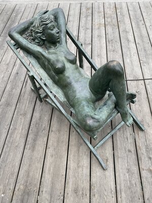 Bronze statue of a sunbathing lady in Oslo